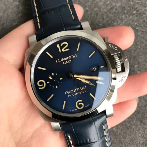 Watch rotated in the palm, light catching the polished bezel and crystal