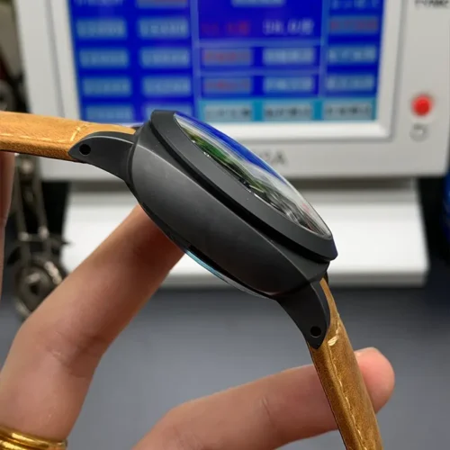Left flank of the matte black case and the curve of the crystal