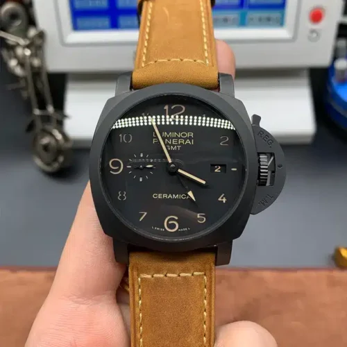 Luminor 1950 GMT PAM441 held up in front of a timing machine