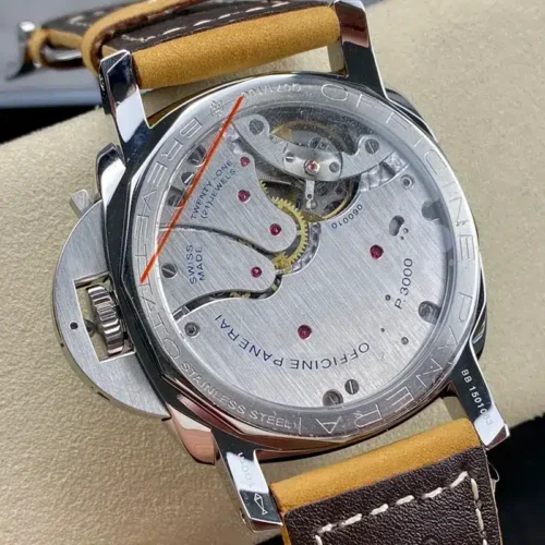 Glass back with the movement, engraved steel ring and crown guard