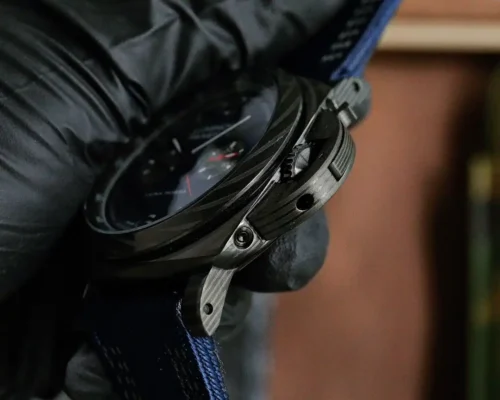 Crown guard side from below, lever and grained black case