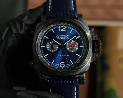 Luminor Chrono PAM1519 in a gloved hand, red hand on the right subdial