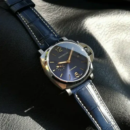Blue dial angled in half shadow, subdial on the left, date on the right