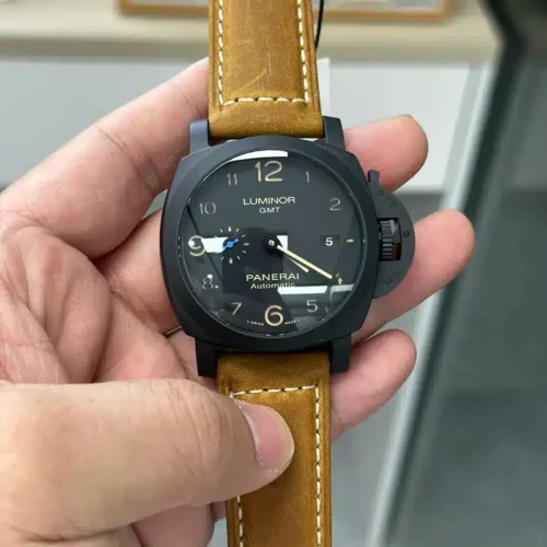 Luminor GMT PAM1441 held face on, Arabic hour numerals and blue seconds hand