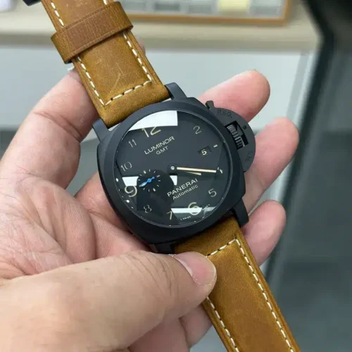Tilted dial with glare on the crystal, blue small seconds at 9