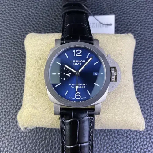 Luminor GMT PAM1279 resting on a cream pillow, blue dial with date 5