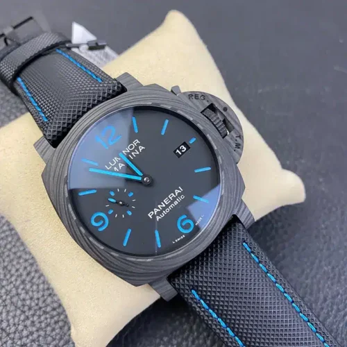 Luminor Marina Carbotech PAM1661 at an angle on the cushion, blue lume