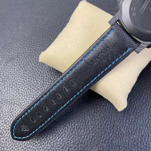 Black leather lining with sky blue stitching, holes punched along the tail