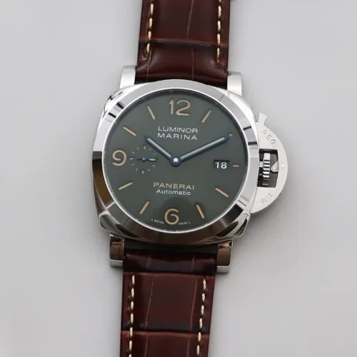 Straight-on photo of the green dial with beige numerals and blue hands