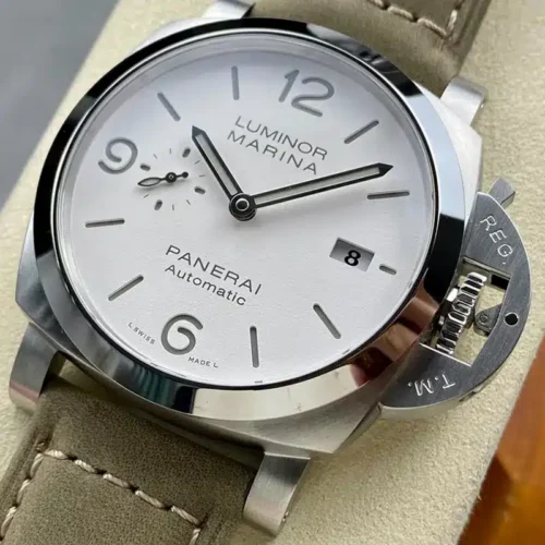 White dial angled right, polished bezel and crown guard lever at lower right