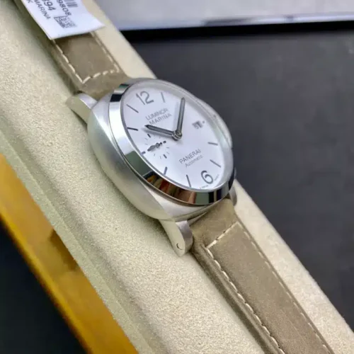 Left flank and polished bezel, white dial turned toward the lens