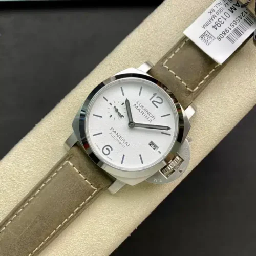 Watch on a cream stand, barcode tag behind the khaki strap