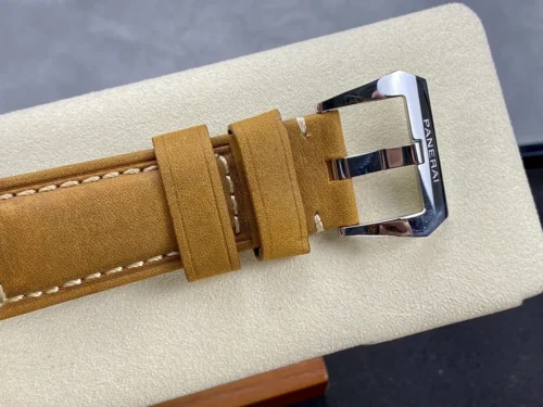 Polished buckle signed Panerai with two keepers on tan leather