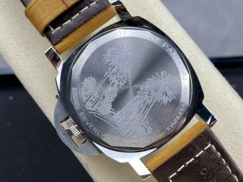 Caseback engraved with tall palm trees, strap lined in dark brown leather