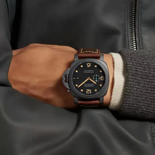 On the wrist under a knit cuff and black leather jacket