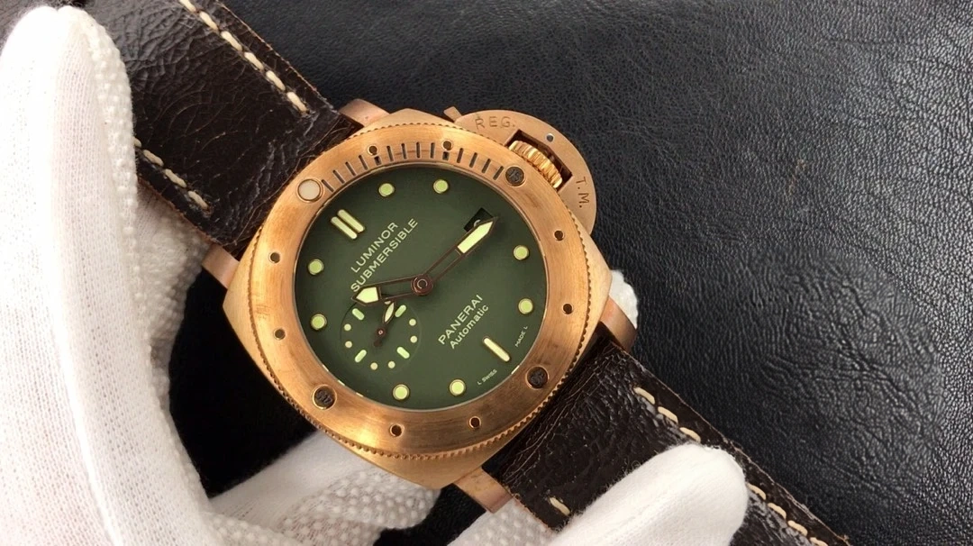 Watch angled across the glove on black leather, crown guard top right