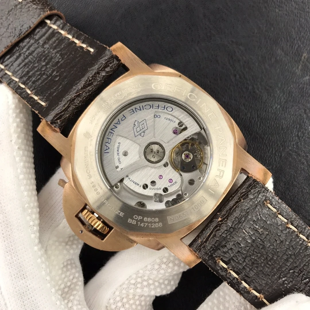 Display back framed in bronze tone, Officine Panerai bridge and balance wheel