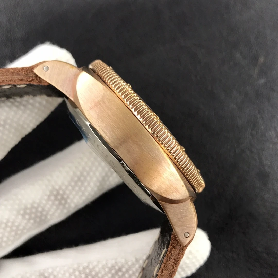 Bronze tone flank and lug screw close up against a black backdrop