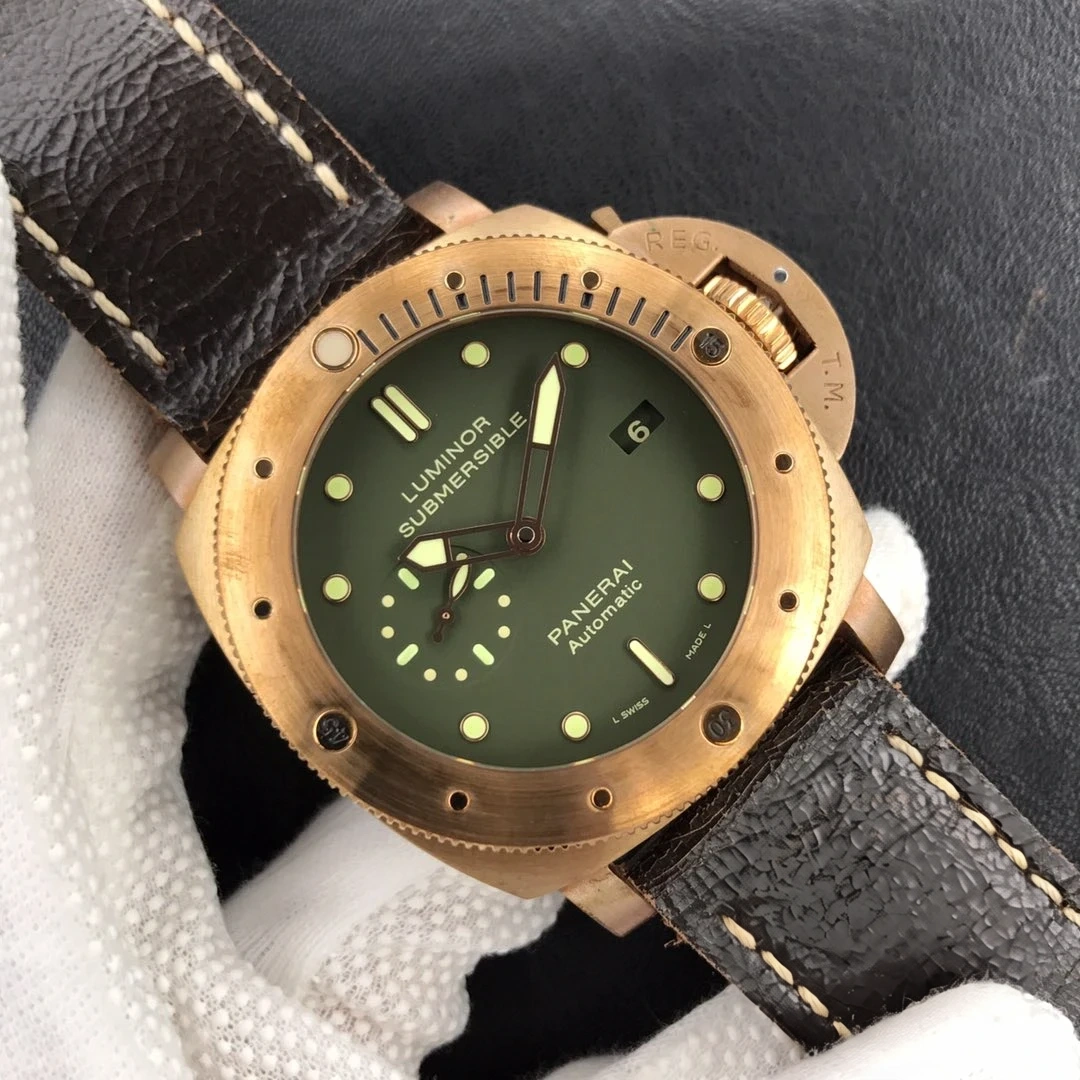 Luminor Submersible PAM382 in a white glove, olive dial and bronze tone bezel