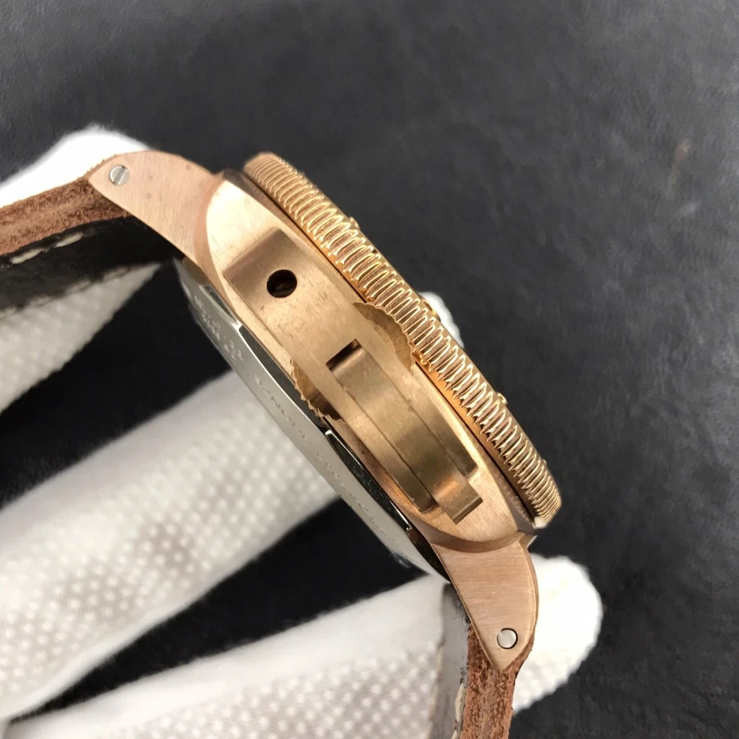 Case side edge on, knurled bezel rim above a slot and round hole