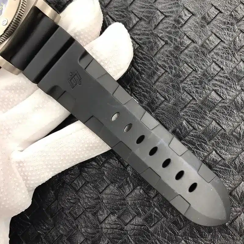 Black rubber strap with a moulded logo and adjustment holes