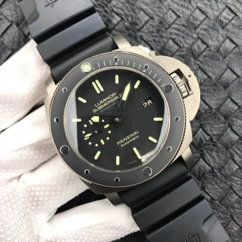 Tilted shot of the matte black dial, date at 3 and baton markers