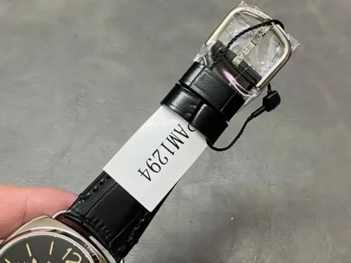 Polished buckle in film above a white reference tag