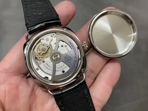 Back unscrewed and set aside, Officine Panerai rotor in the open case