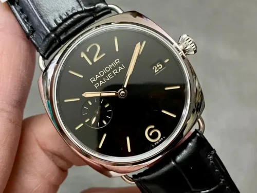 Black dial tilted in the fingers, date 25 window and slim baton markers