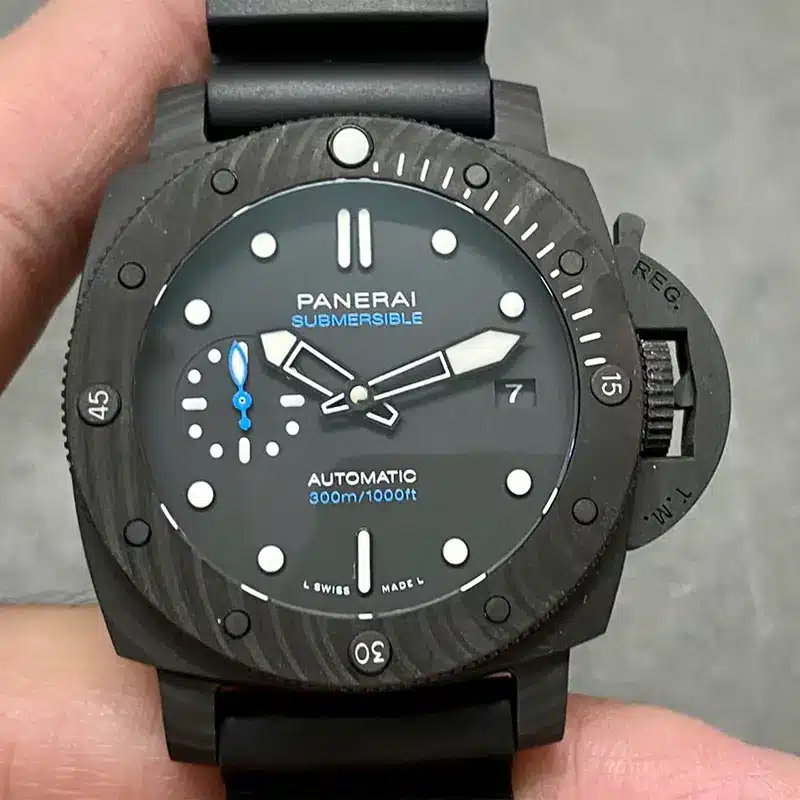 Black dial held close, blue Submersible lettering and date 7