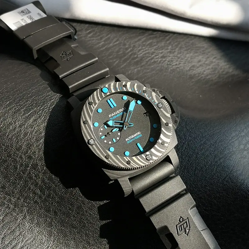 Submersible Carbotech PAM960 set diagonally, embossed logo on the black rubber