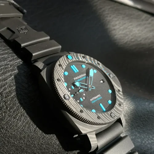 Dial seen from the 9 o'clock side, pale blue indices and hands