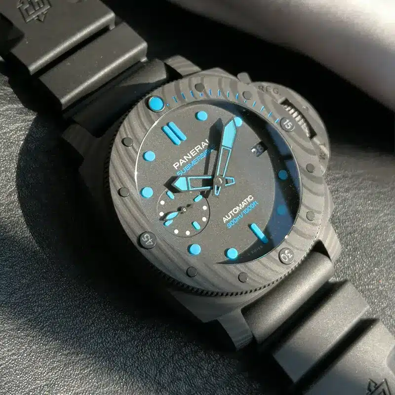 Tilted close view, aqua minute hand over the grained bezel