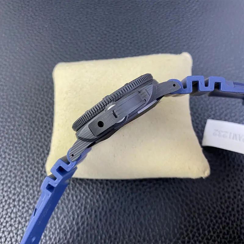 Crown guard seen from the side, blue strap curling off the cushion