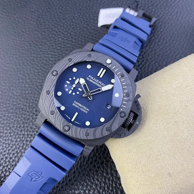 Submersible PAM1232 lying diagonally on the cushion, blue strap with raised logo