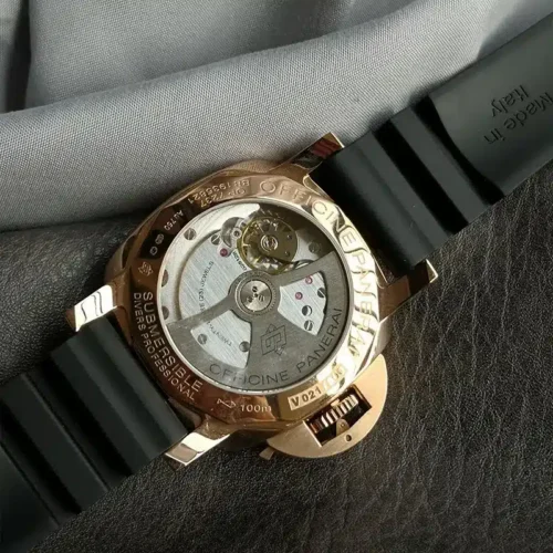 Glass back showing the rotor and bridges inside a rose gold tone rim