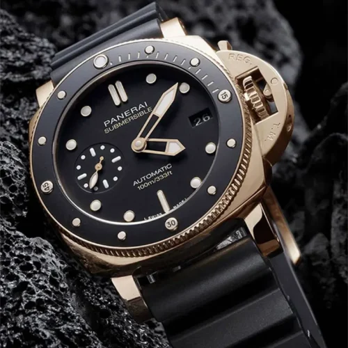 Submersible PAM974 on dark porous rock, rose gold tone lugs and black dial