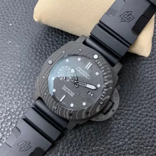 Marbled black bezel and date 24, watch propped on a cream pillow