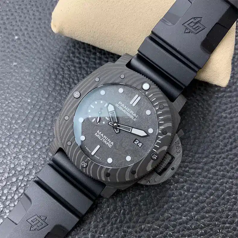 Marbled black bezel and date 24, watch propped on a cream pillow