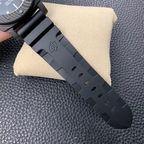 Underside of the black rubber strap, row of holes and raised logo