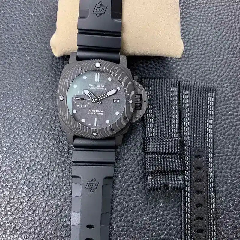 Submersible PAM979 next to a second strap in black canvas with grey stitching