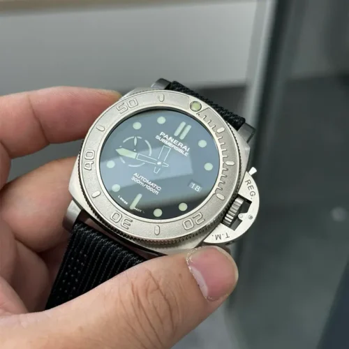 Glare across the crystal as the case turns right, crown guard lever visible
