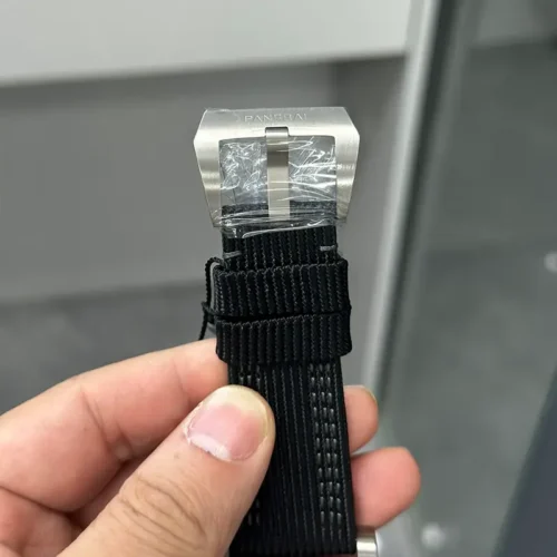 Brushed buckle with Panerai on the frame, still wrapped in plastic film