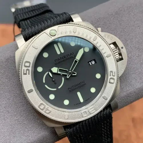 Angled close view of the grainy grey bezel and luminous hour plots