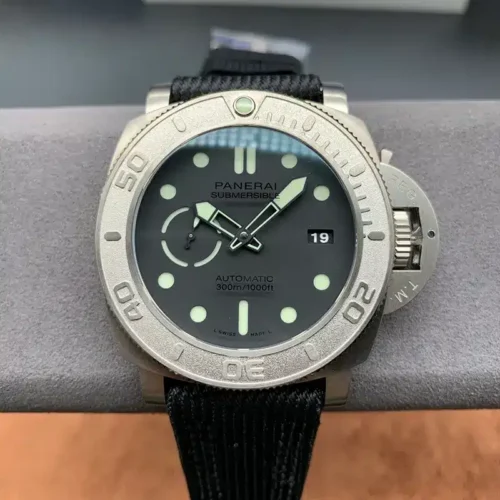Submersible PAM984 on a grey stand, dark dial with the 19 date