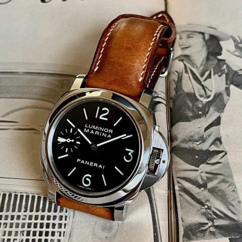 Panerai Luminor Marina with black dial, crown guard bridge and brown leather strap